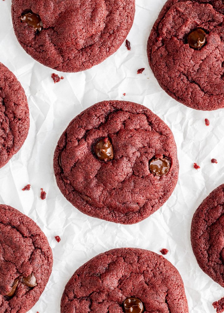 red velvet cookies from above with crumbs around them