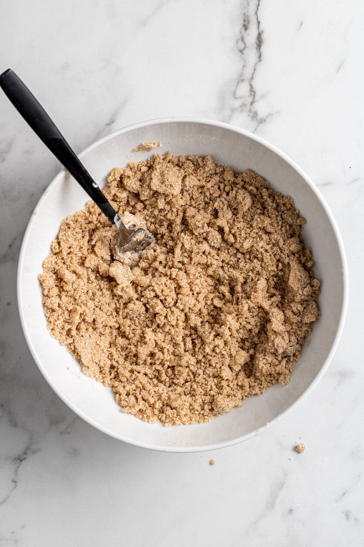 sugar and cinnamon and butter in a bowl to make cinnamon streusel