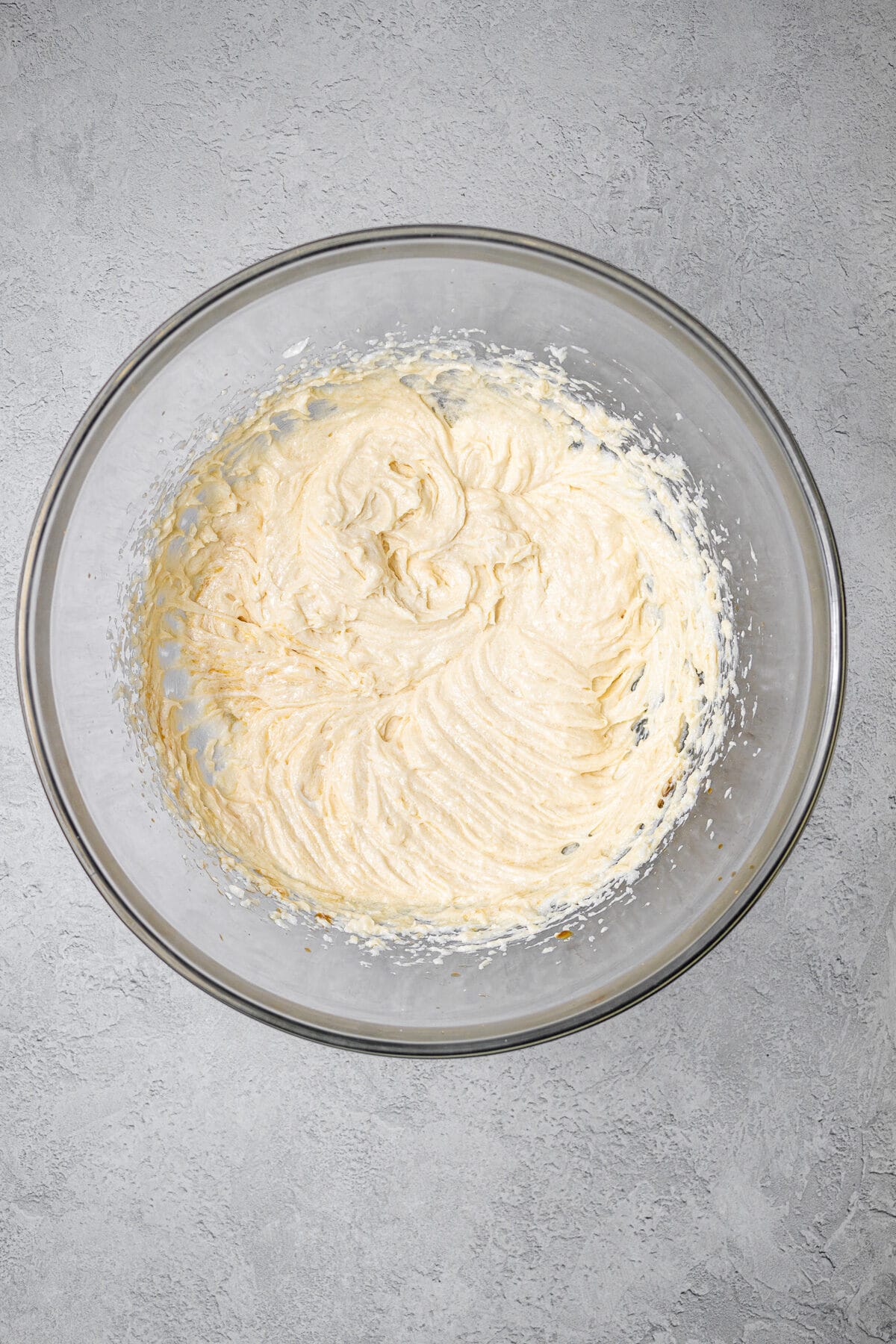 butter, sugar, egg, and vanilla mixed in a bowl