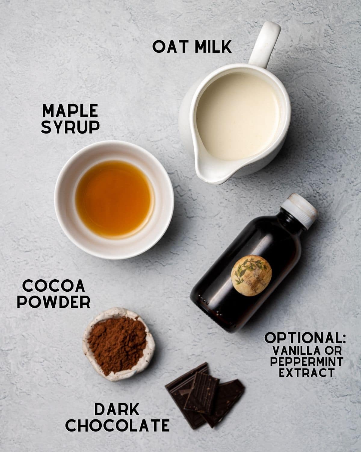 ingredients needed to make oat milk hot cocoa with text overlay labels
