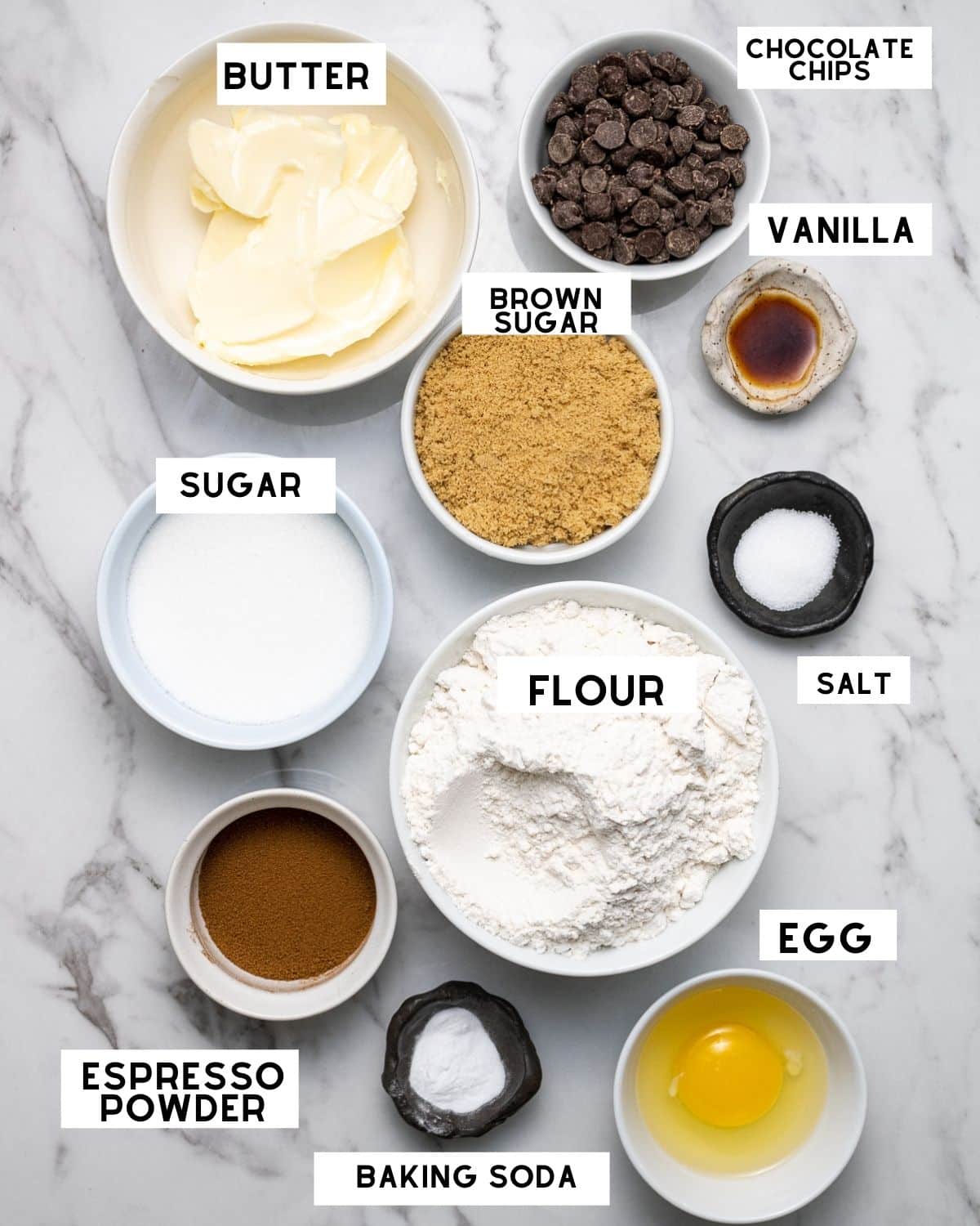 Coffee cookie ingredients pictured in bowls with labels