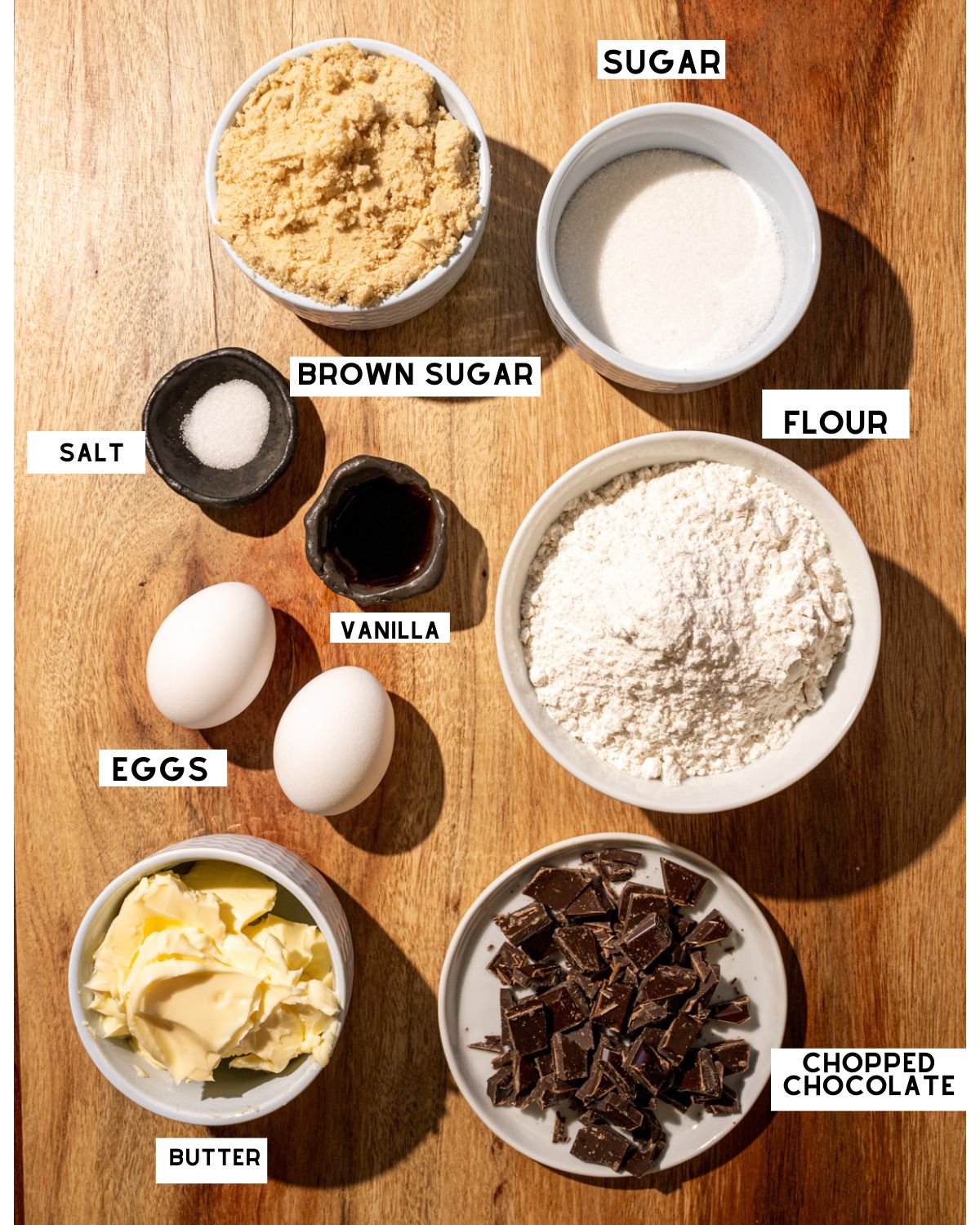 ingredients needed to make blonde brownies in bowls with labels