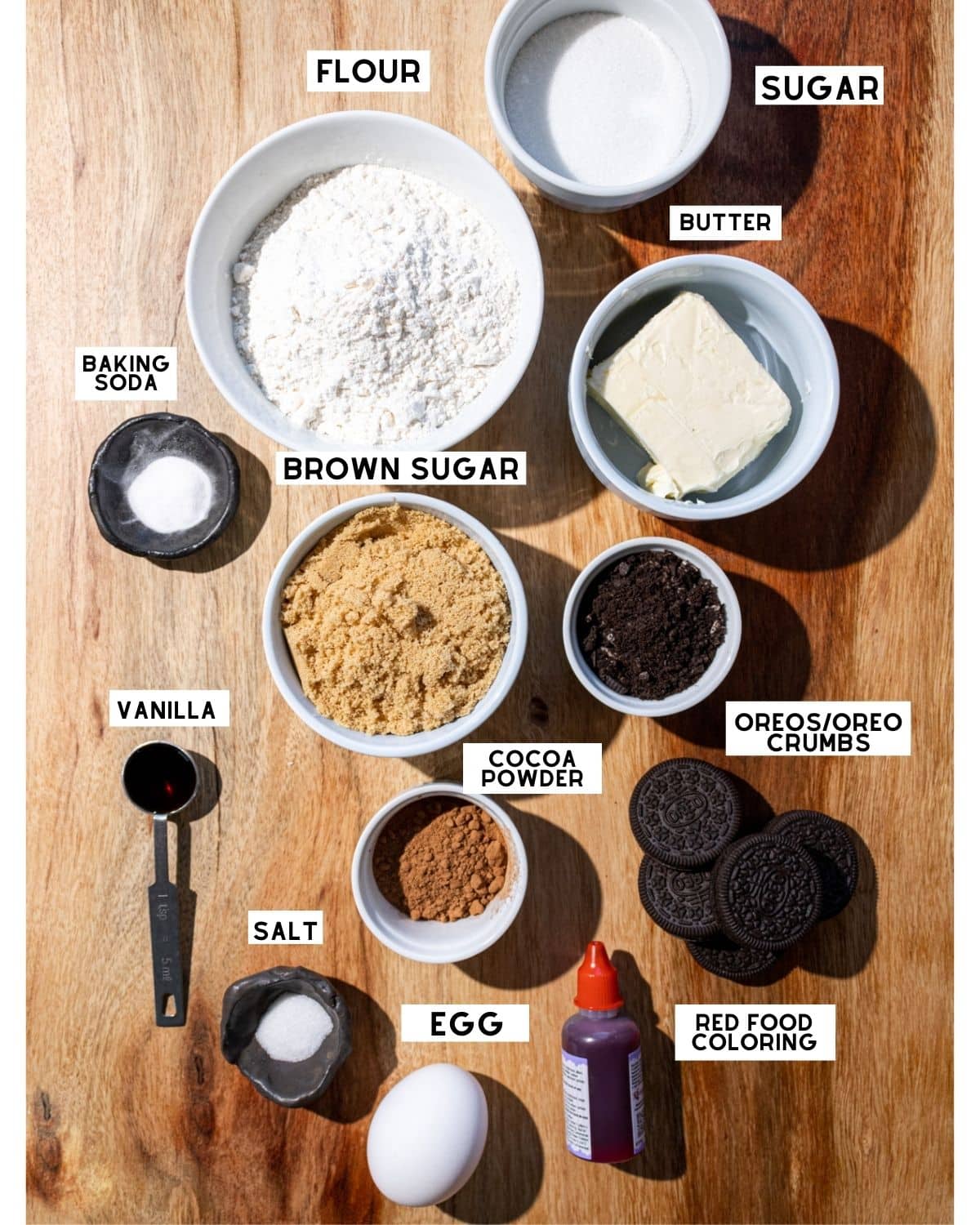Red velvet oreo cookie ingredients in bowls with labels