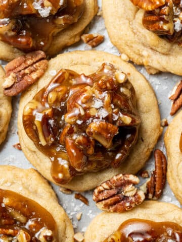 Tray of pecan pie cookies topped with pecans