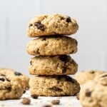 Four oatmeal raisin cookie stacked with cookies around
