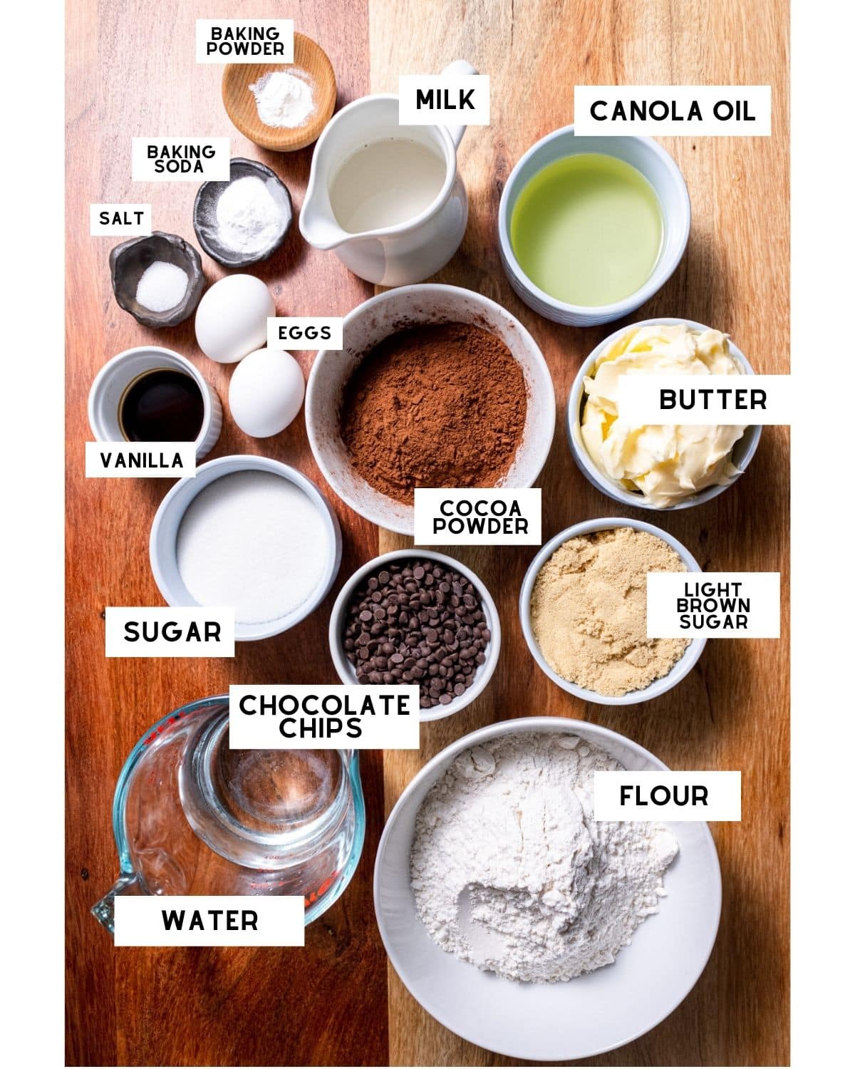 Ingredients for Cookie Dough Cake in bowls with labels