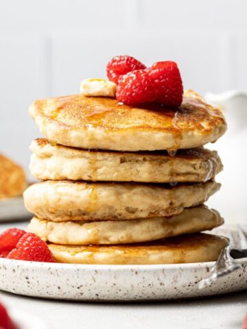 Almond milk pancakes stacked on top of each other.