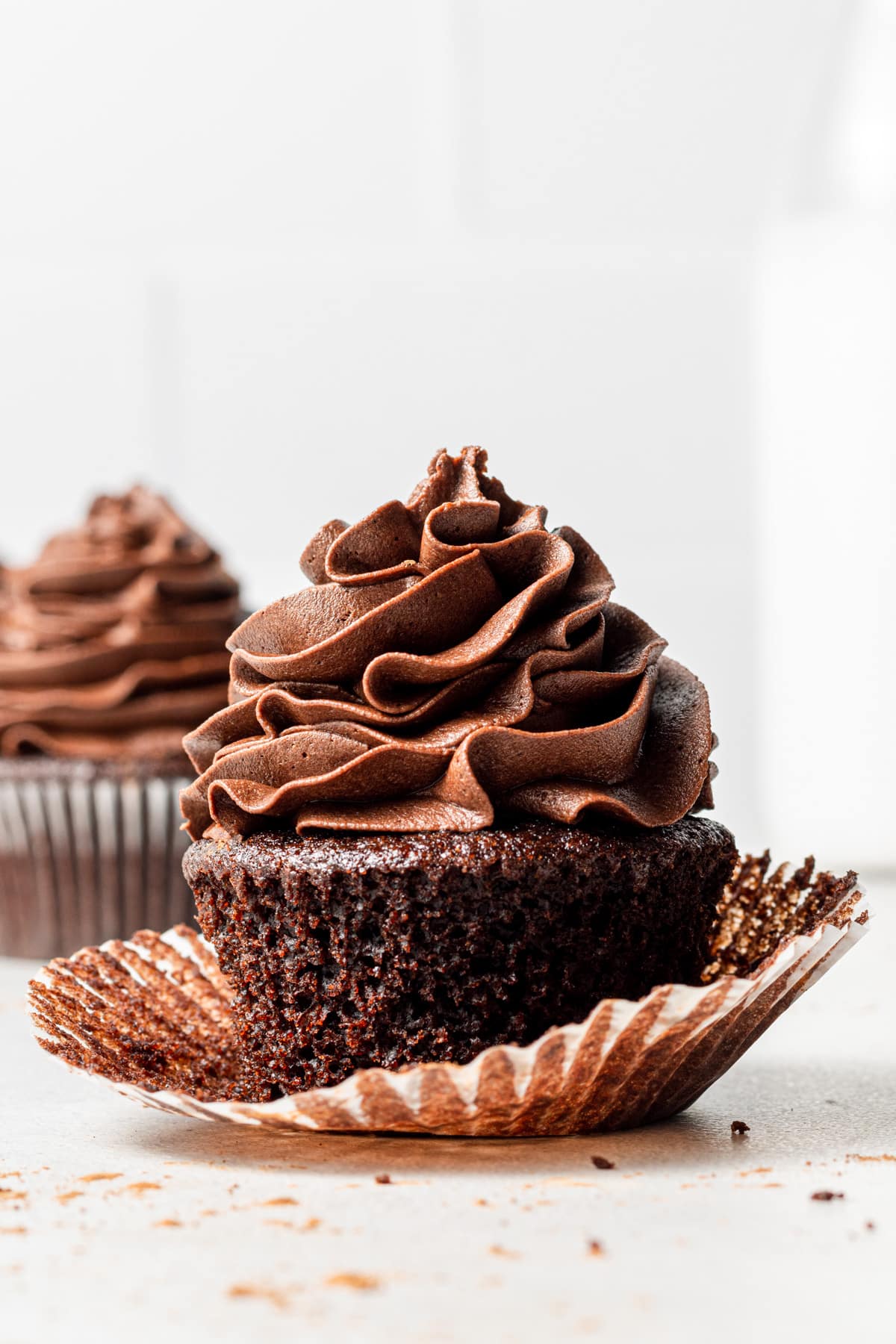 Eggless chocolate cupcake with cupcake liner open