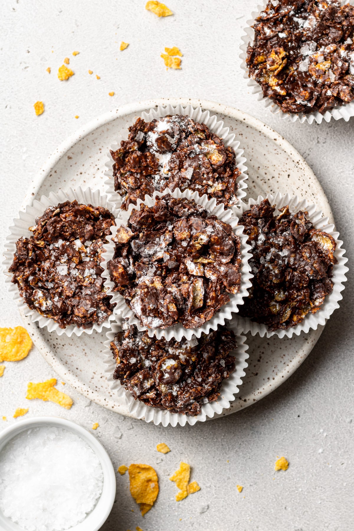 five chocolate cornflake cakes on a plate