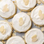 Soft almond sugar cookies on a baking sheet