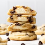 chocolate chip cheesecake cookies split in half and stacked on top of each other