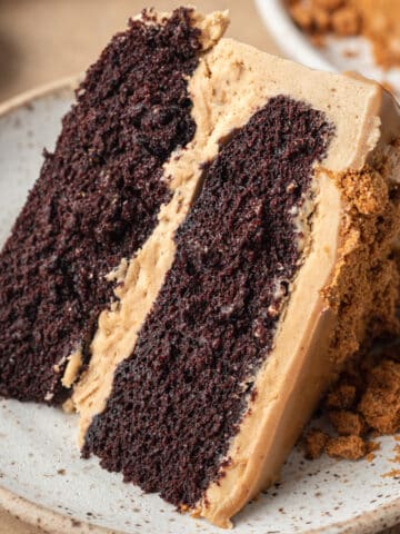 chocolate biscoff cake slice on a plate
