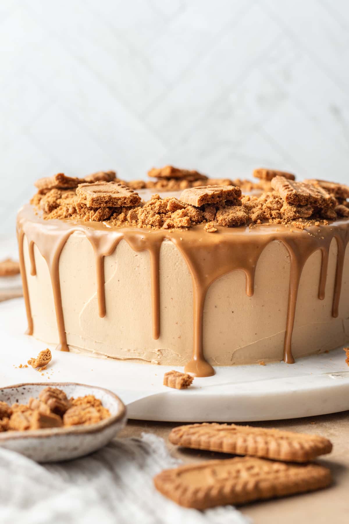 round chocolate biscoff cake decorated with biscoff spread and cookies 
