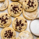 Chocolate Chip Sugar Cookies on a tray with a small bowl of sugar
