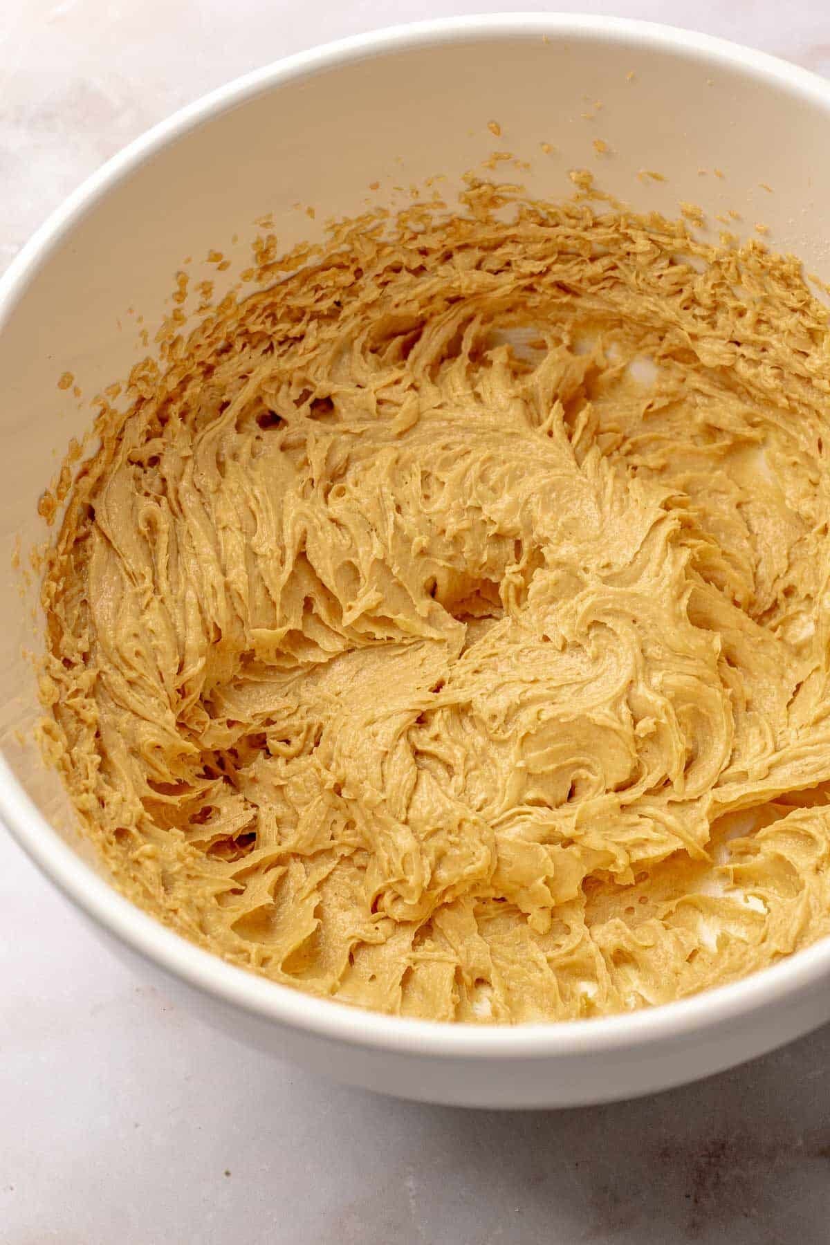 wet ingredients for cookies mixed together in a white bowl.
