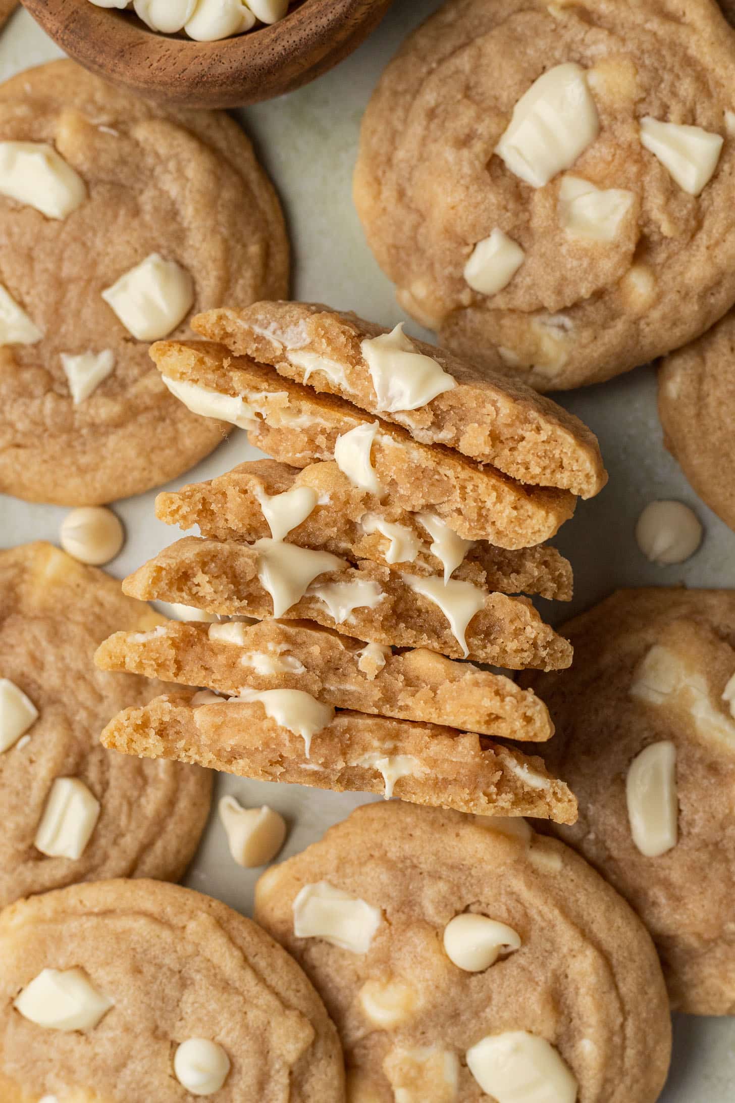 five cookies split in half stacked on top of each other with more cookies beside them.