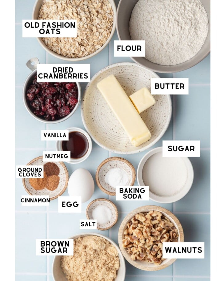 cranberry walnut oatmeal cookies ingredients in small bowls